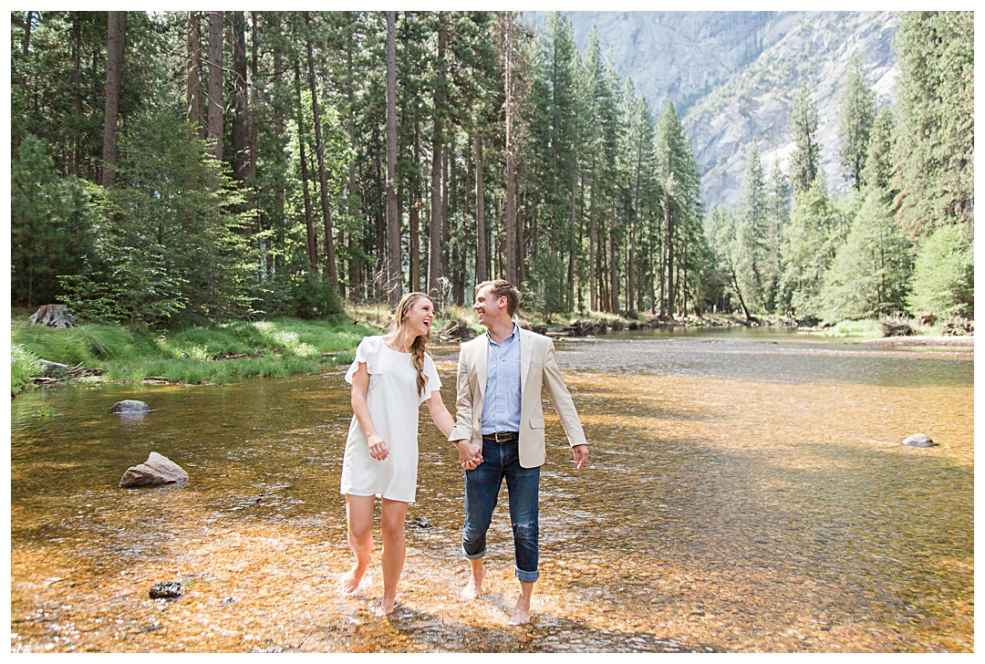 cute engaged couple in creek
